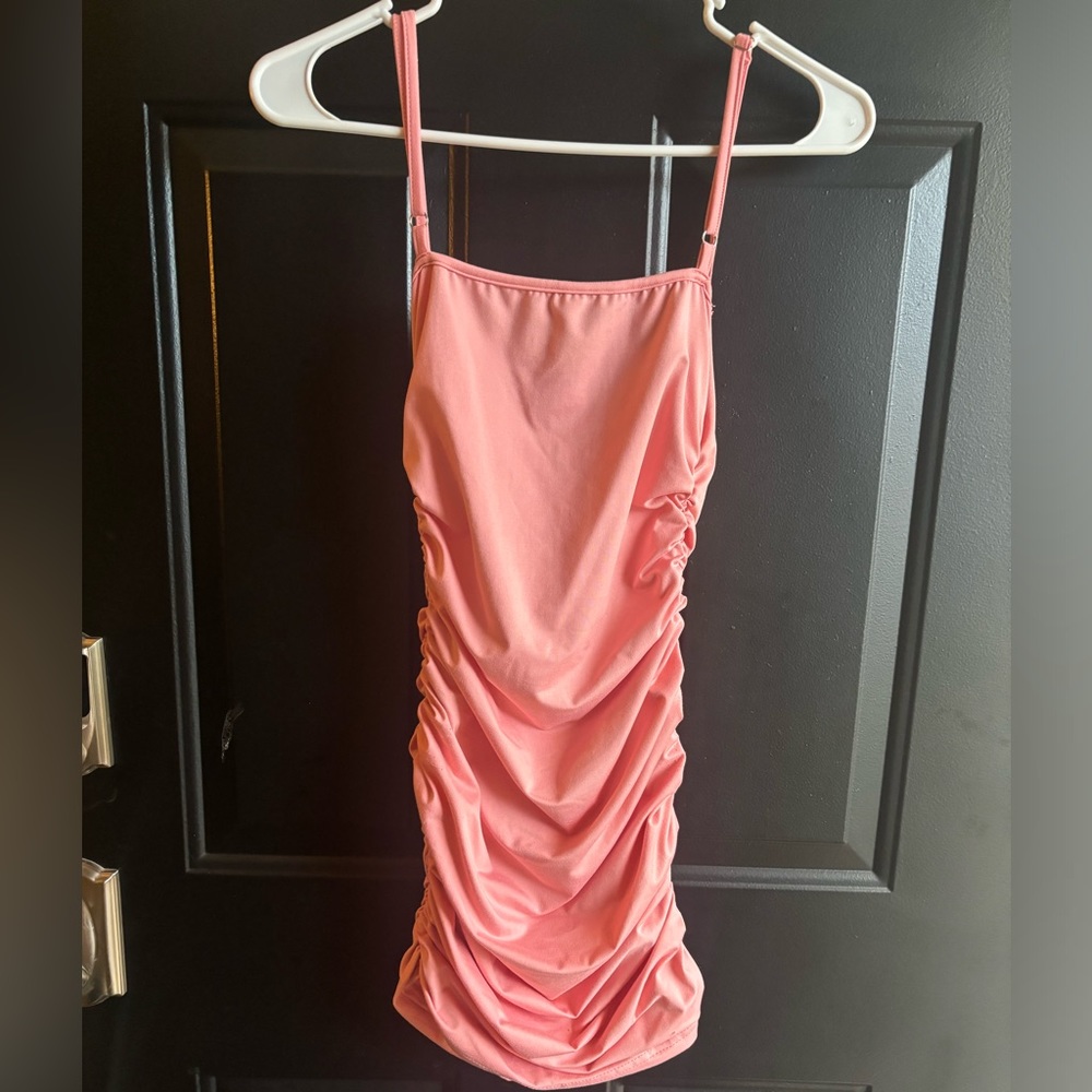 Pink elastic bodycon dress.